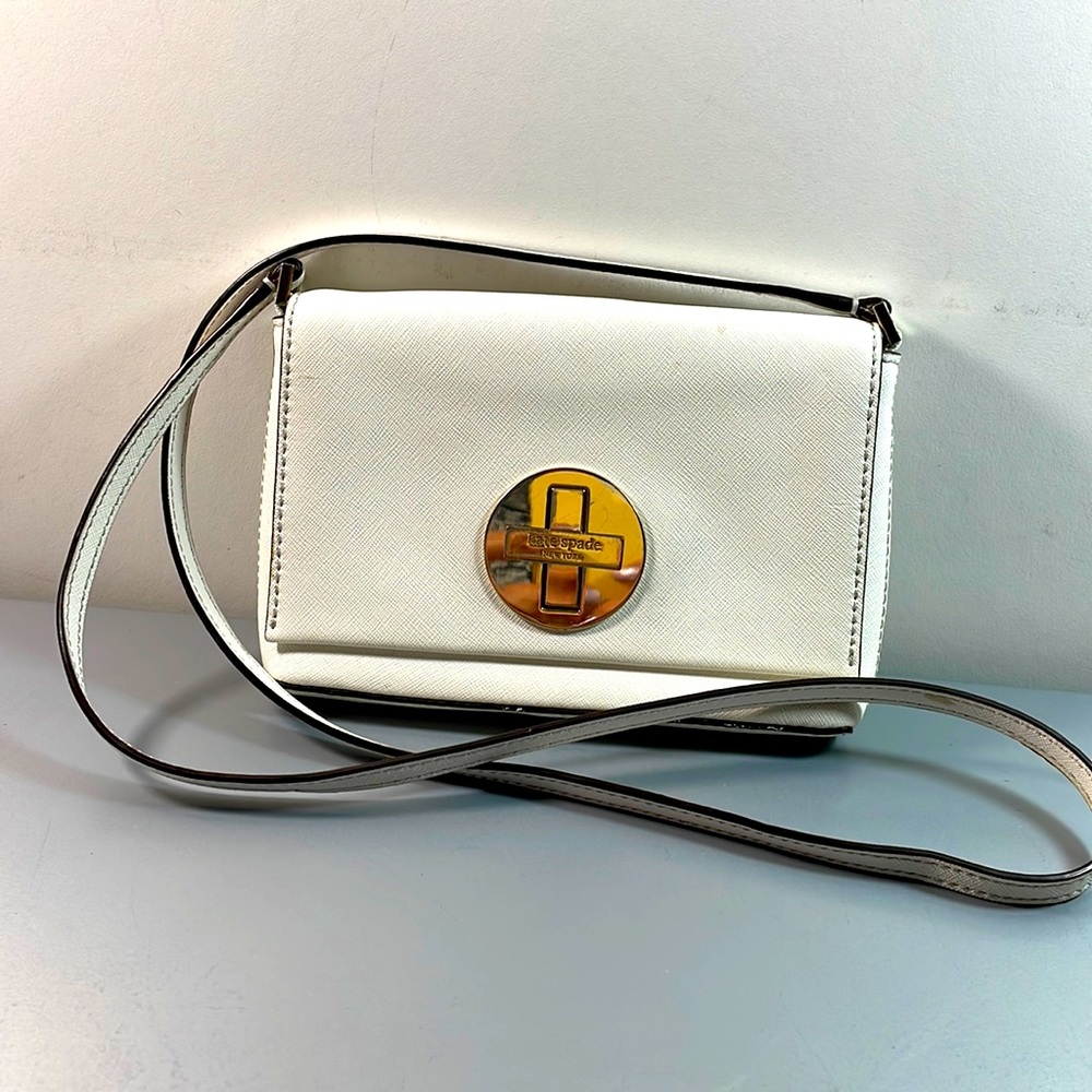 Kate Spade New York White canvas small flip crossbody bag purse